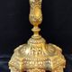 Pair of antique carved bronze candlesticks.