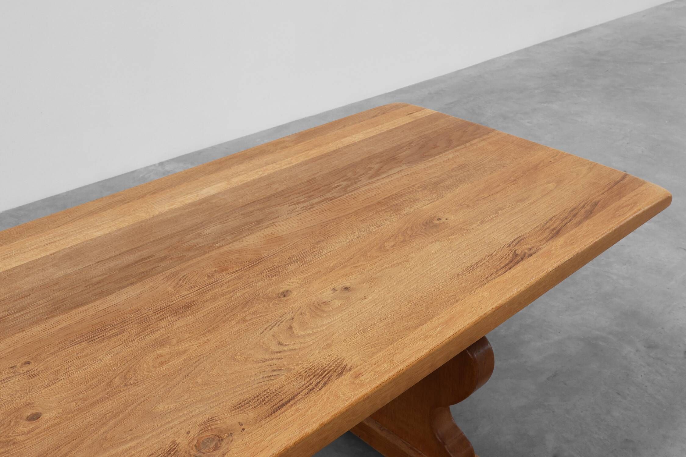 20th Century French oak trestle table with scalloped legs and plank top