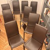 Many brown leather chairs "Roche Bobois"