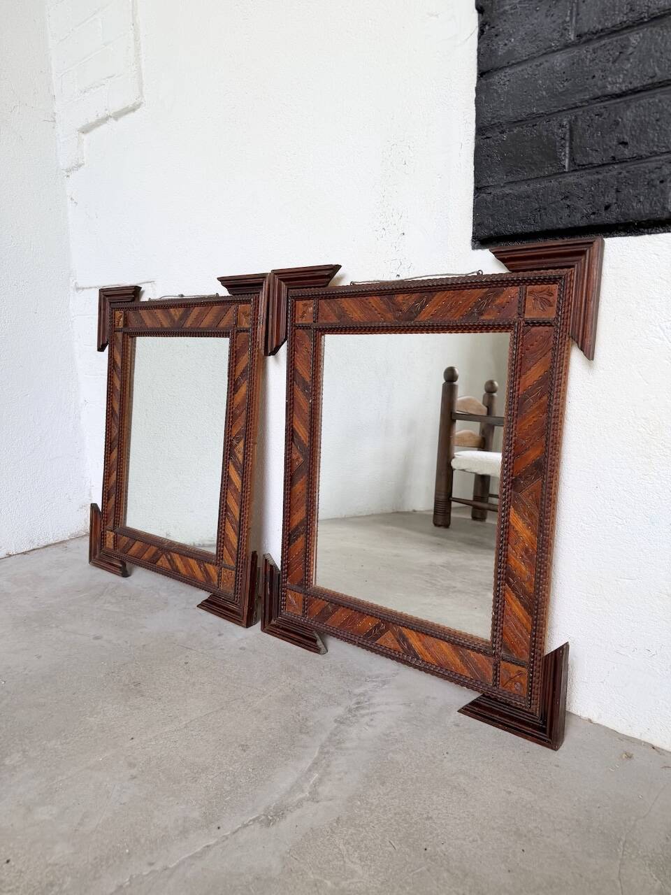 Pair of wooden mirrors in tramp art style