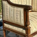 Low armchair in finely carved wood in the Louis XVI style from the 19th century