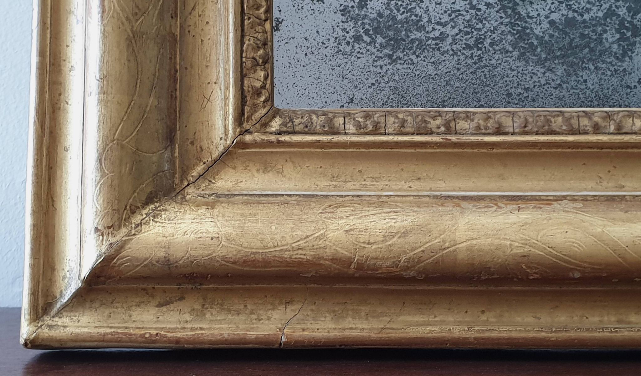Old gilded mirror and old mercury glass - wall mirror with gold leaf