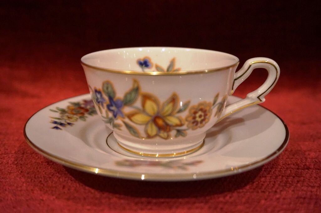 Old saucer cup in pink porcelain of Limoges