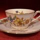 Old saucer cup in pink porcelain of Limoges