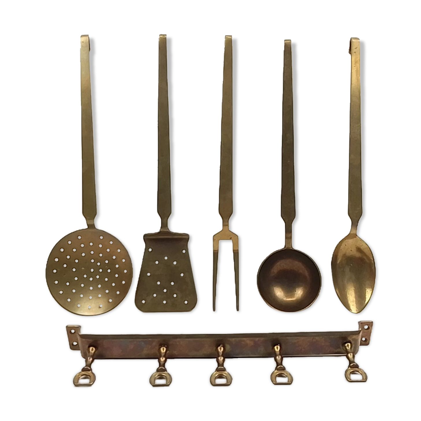 5 kitchen utensils and a brass wall mount