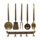 5 kitchen utensils and a brass wall mount