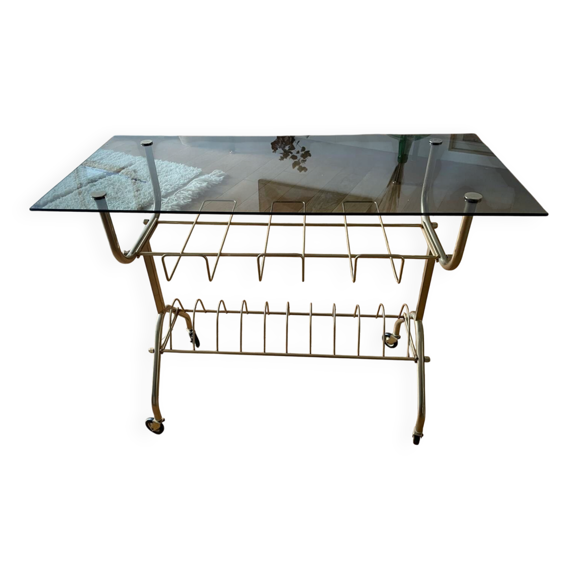 Green and brass trolley on wheels