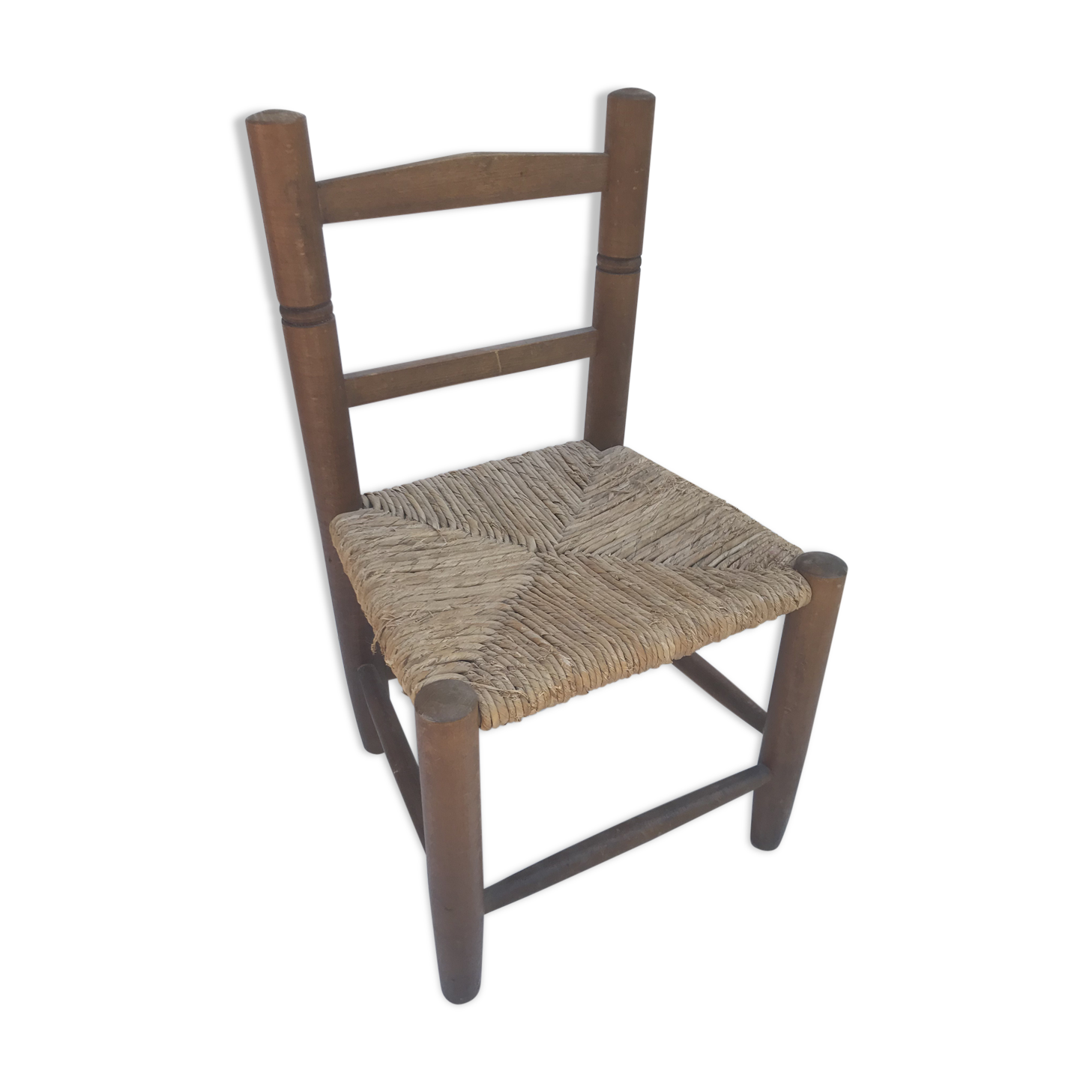 Old wooden children's chair with vintage braided seat