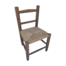 Old wooden children's chair with vintage braided seat