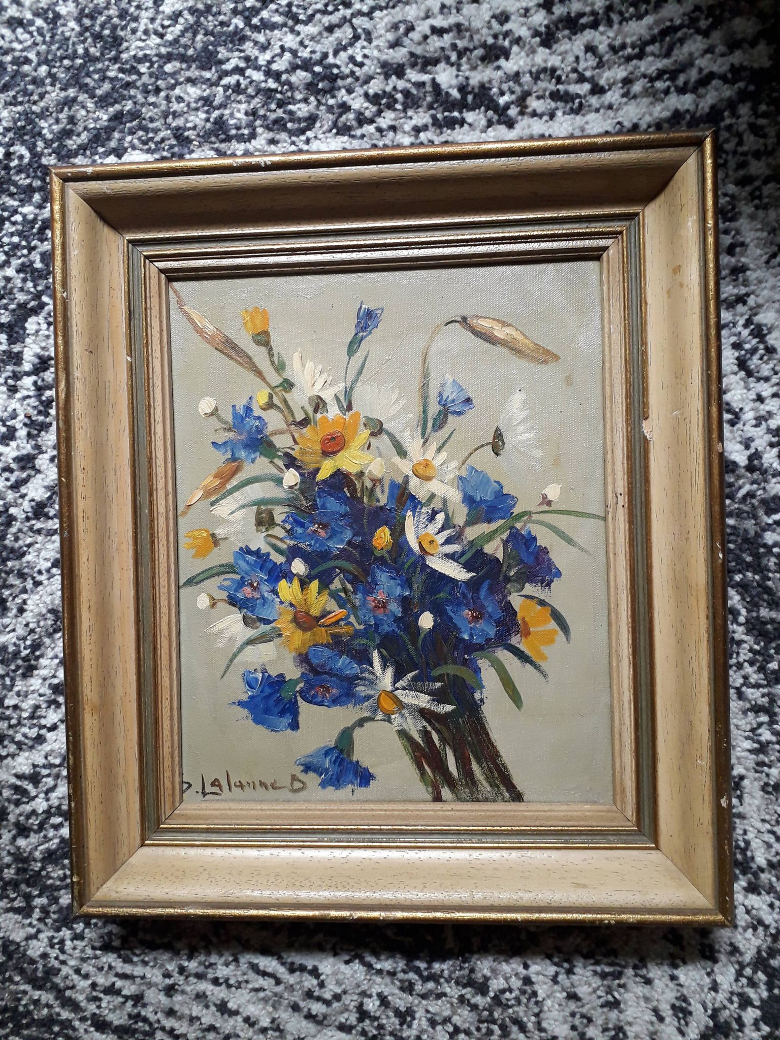 Old oil painting depicting a bouquet of flowers.