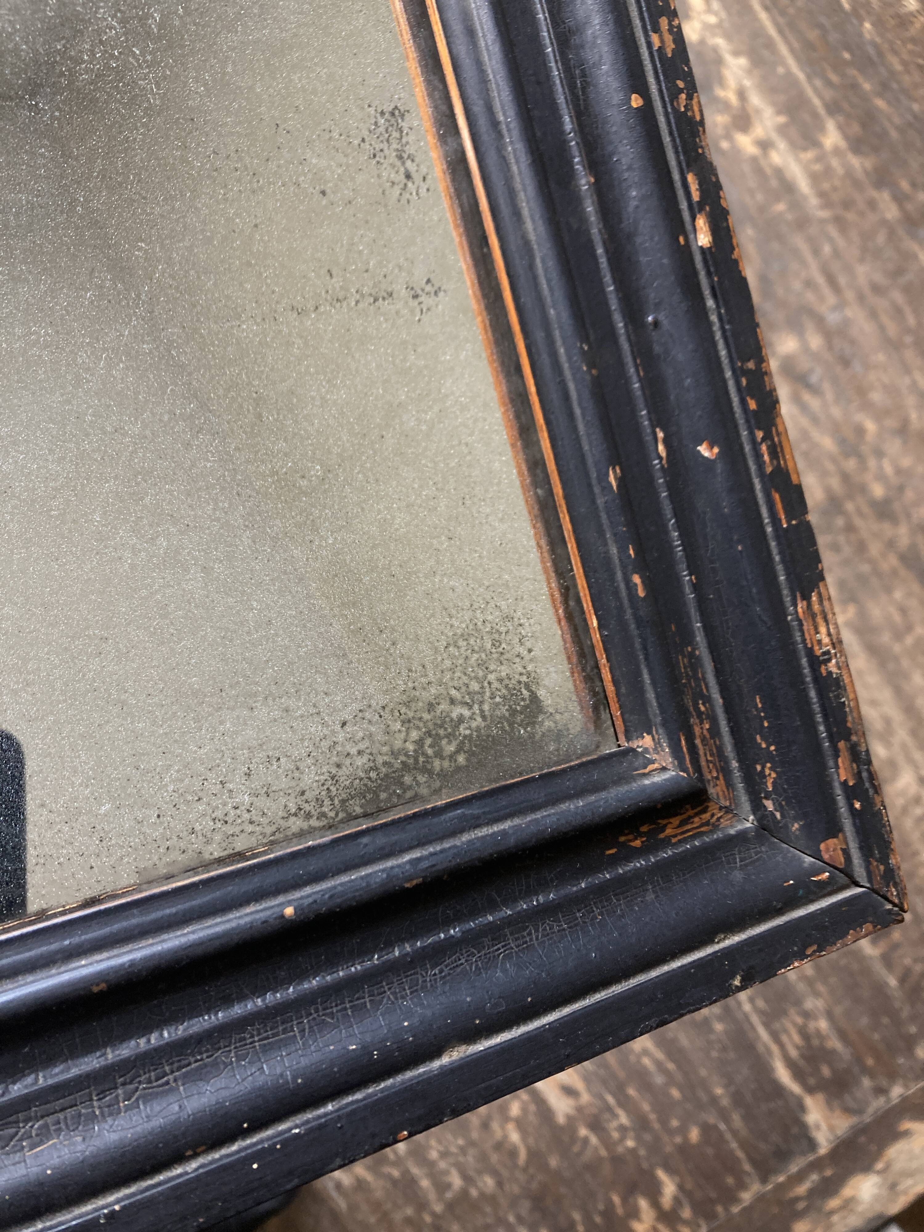 19th century blackened mirror with pitted glass 34cm x 40cm