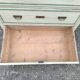 4-drawer chest of drawers with yellow and green patina by a local artist