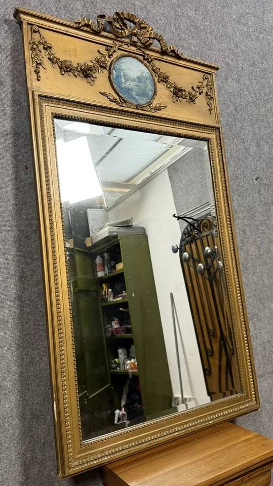 Louis XVI style trumeau mirror in gilded wood, circa 1900