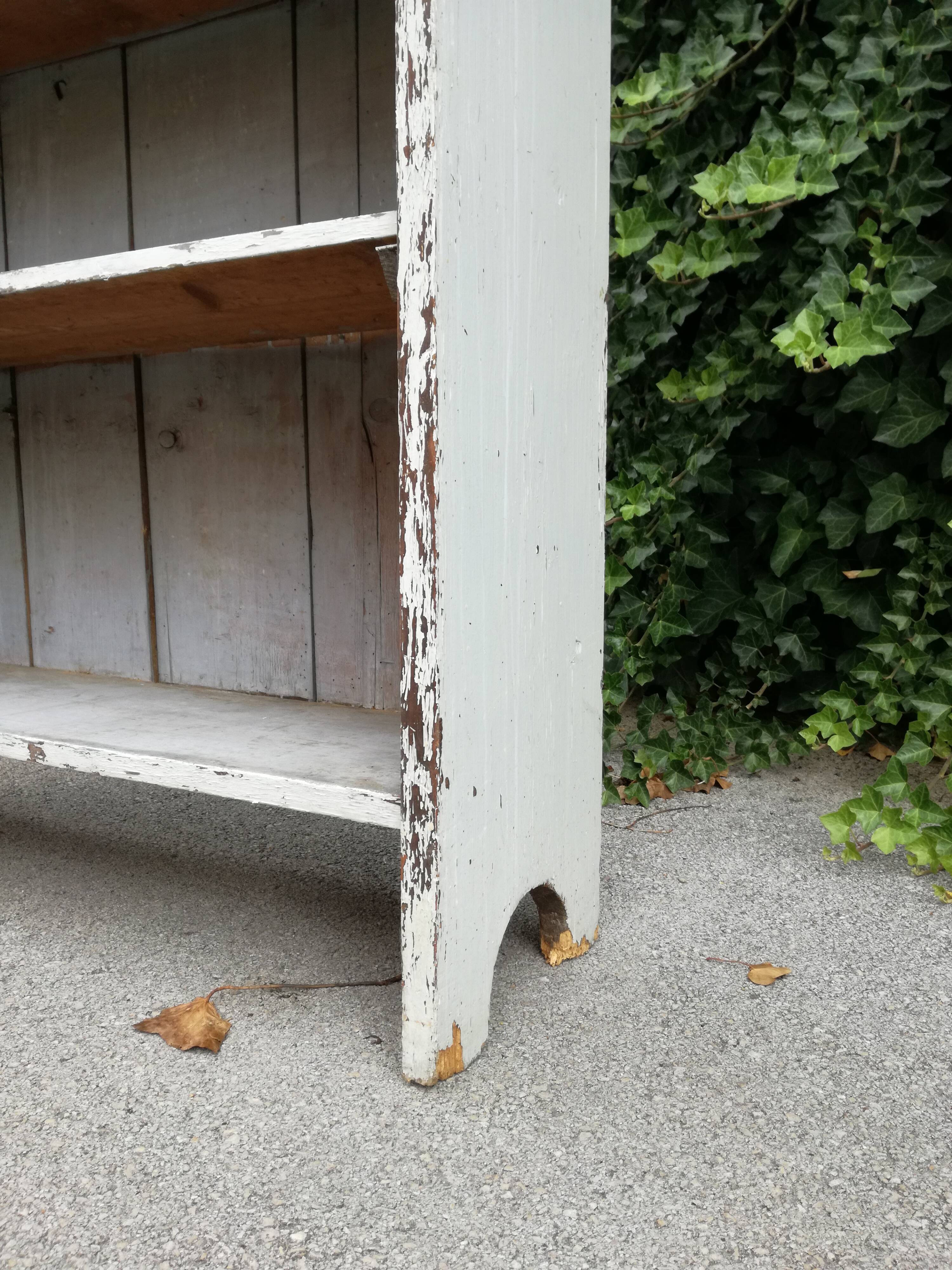 Old white shelf in weathered pine