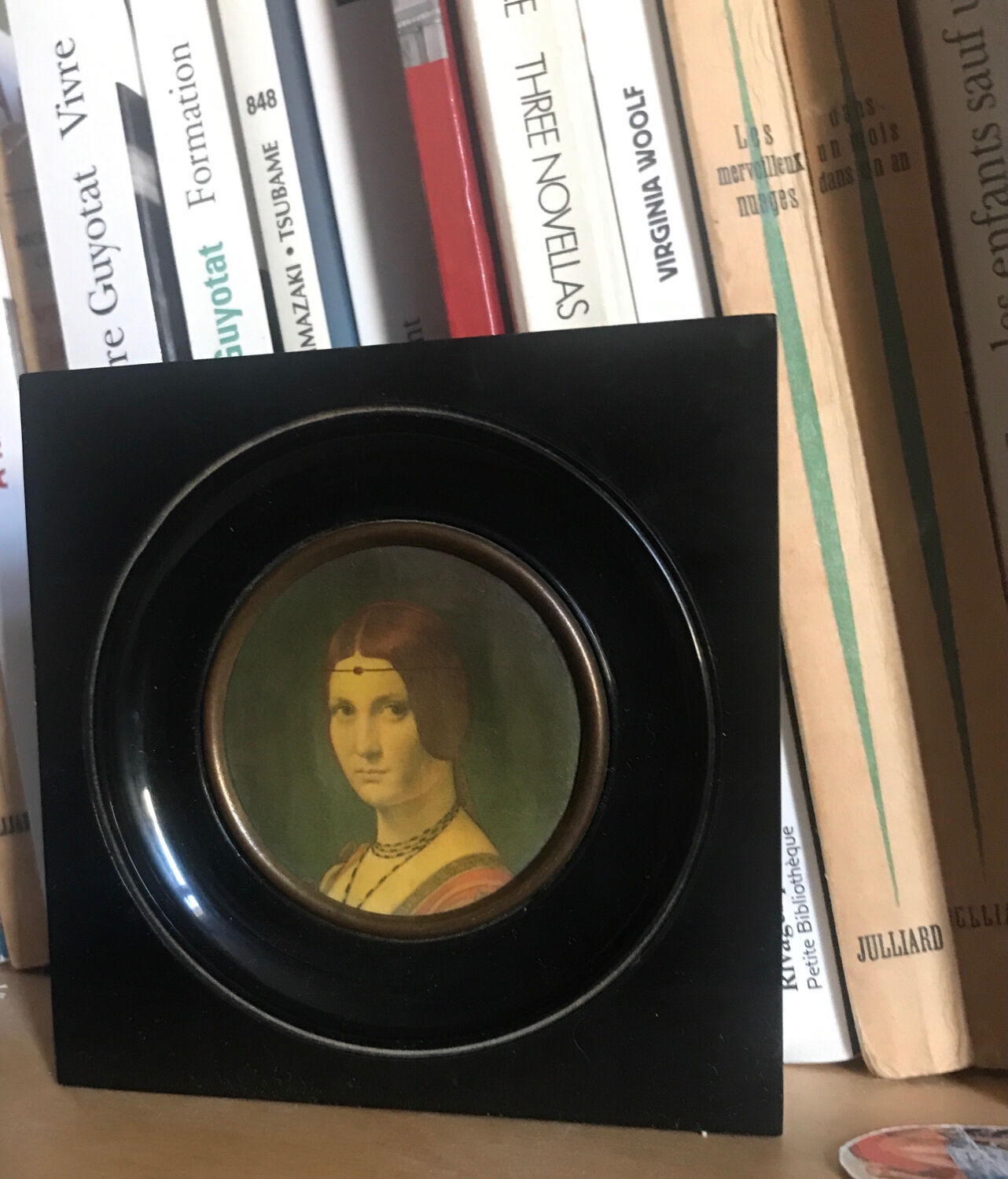 Two vintage round frame portraits