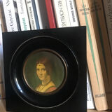 Two vintage round frame portraits