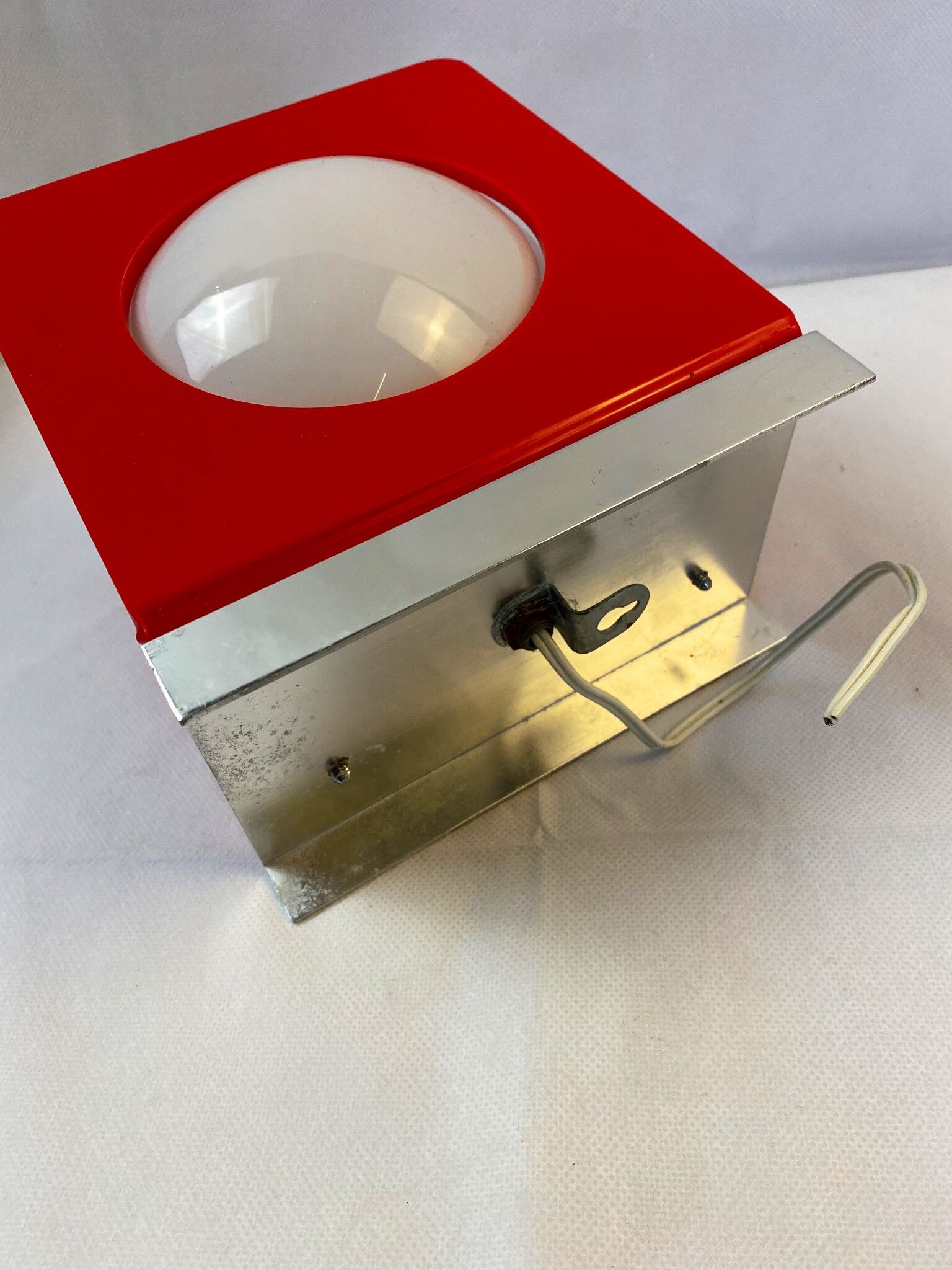 Wall lamp from the 60s in red plastic with white globe