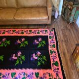 Oltenian floral rug handwoven in wool, purple flowers on black and pink background