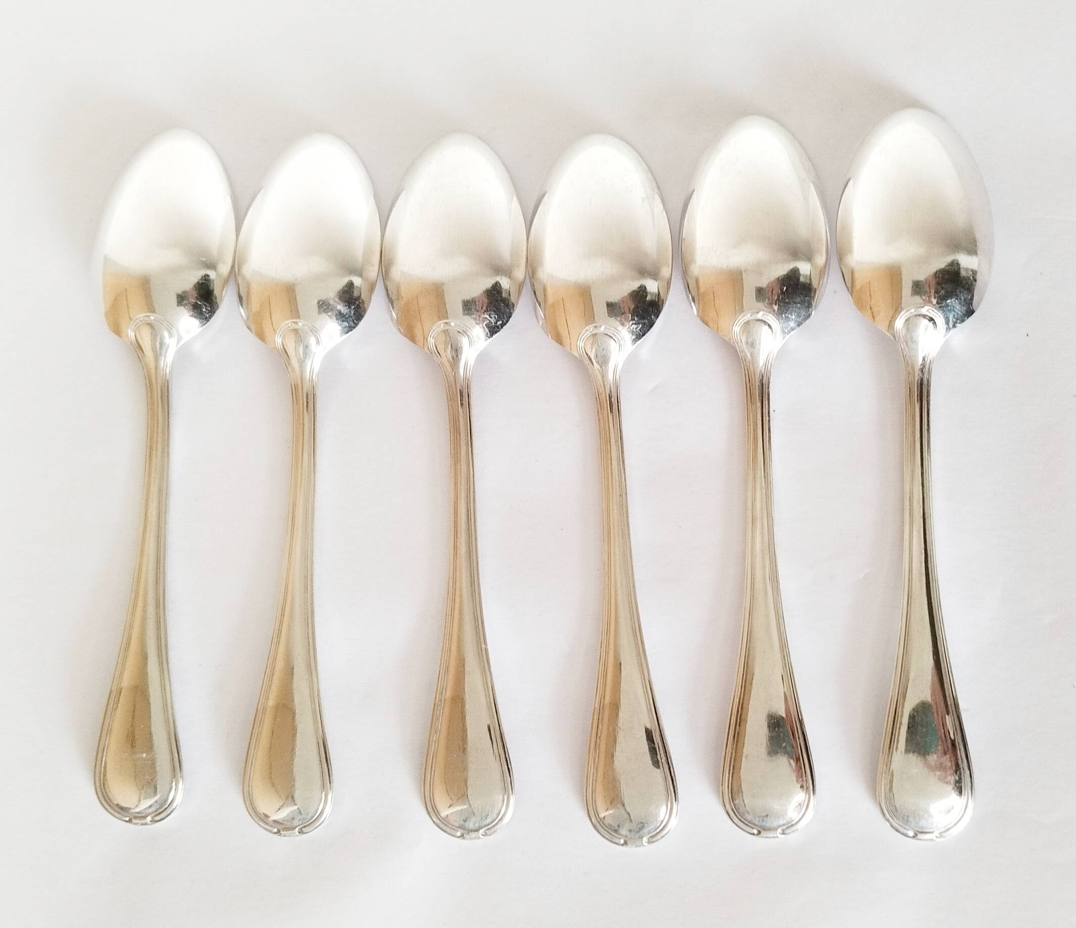 Dessert spoons, silver teaspoons