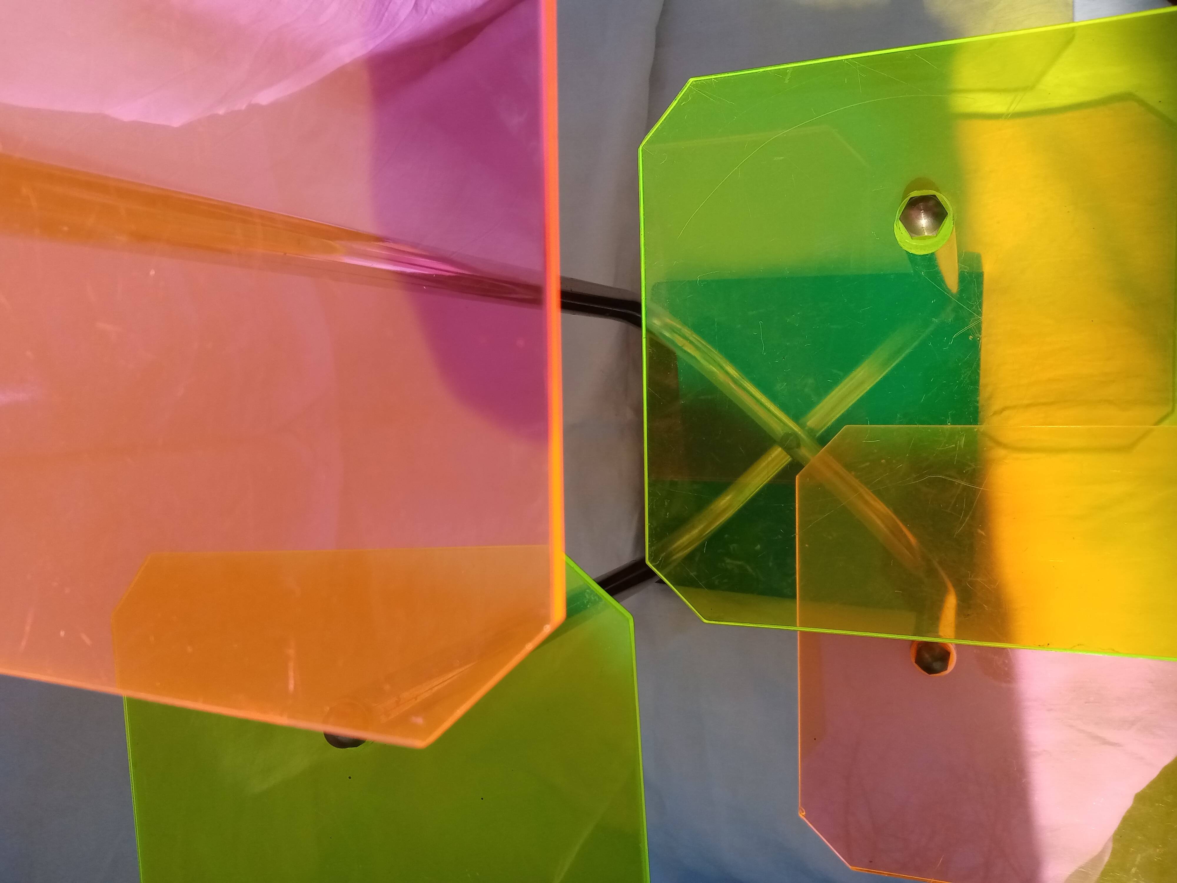 Display shelf with plexiglass trays in 1970s colours.