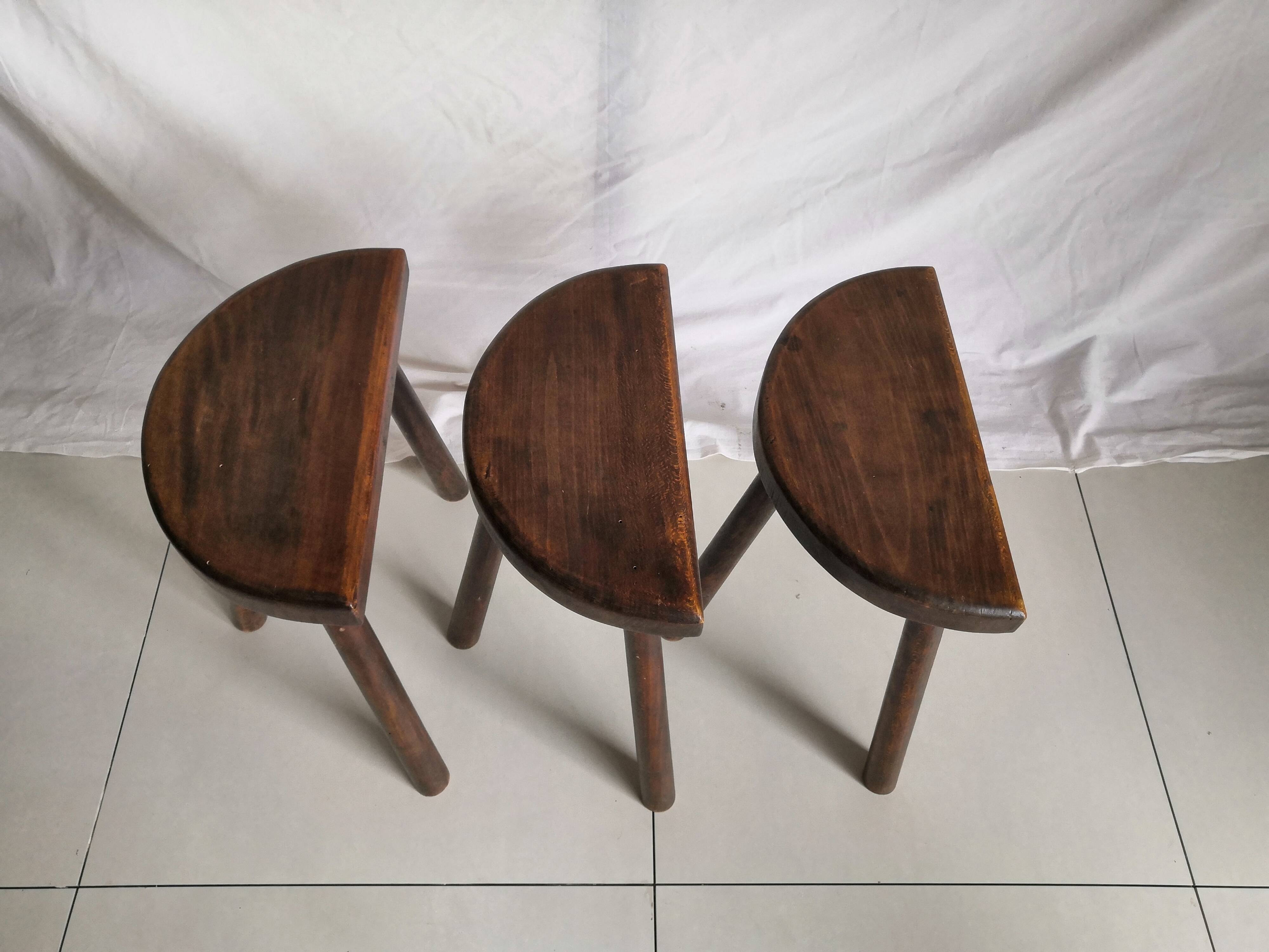 Trio of vintage brutalist tripod stools