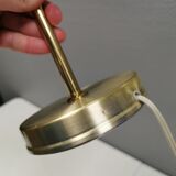 Older Swedish table lamp, estimated 1980s, in gold-colored aluminum with “bend”.
