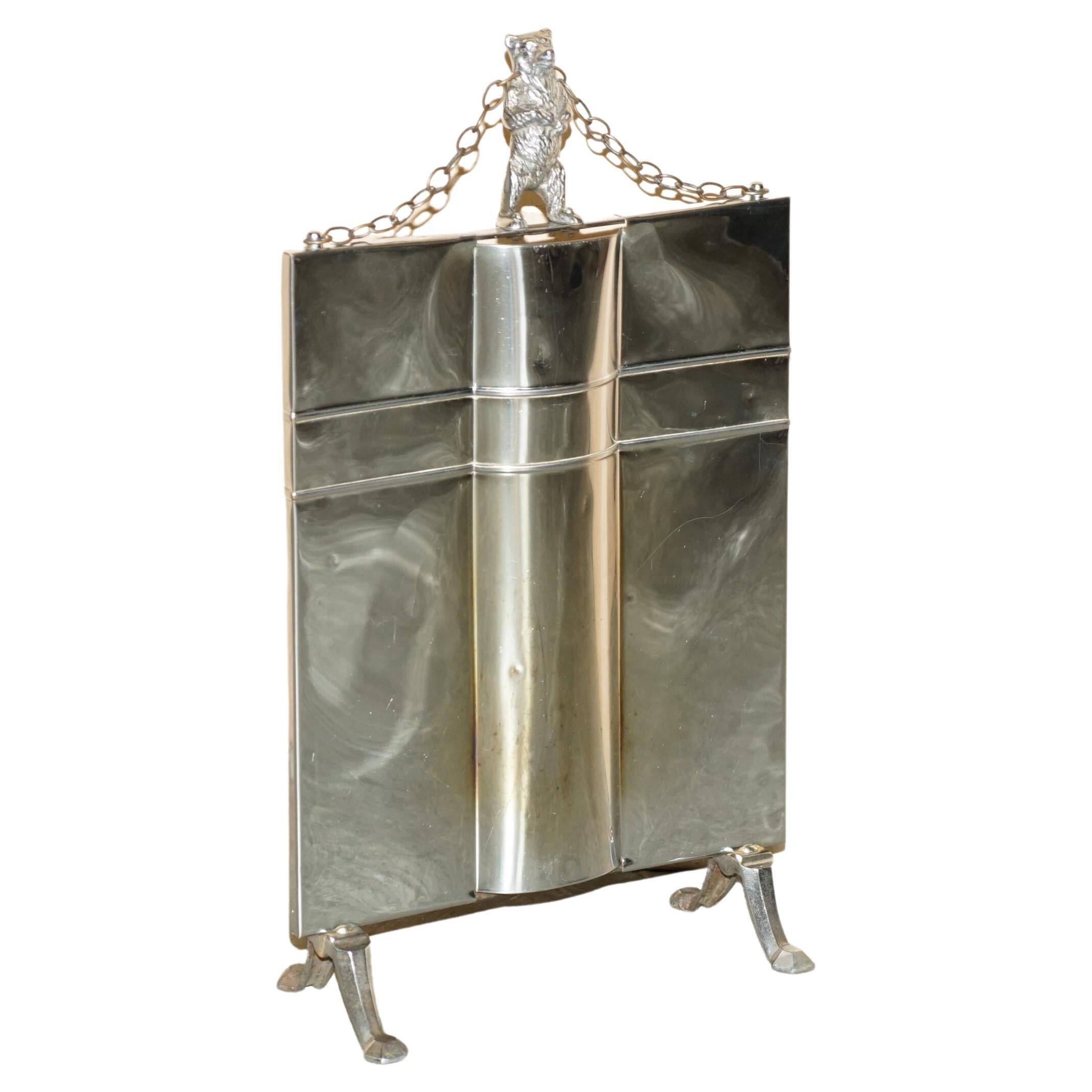 Art Deco fire screen from around 1920 in polished chrome with a bear.