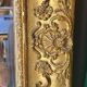 Antique Louis Philippe style gilded mirror decorated with floral motifs