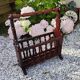 Rustic stained wooden magazine rack