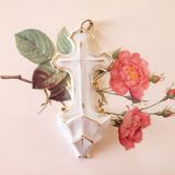 Antique holy water font in white porcelain biscuit.