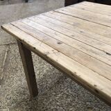 Washed-out wooden dining table