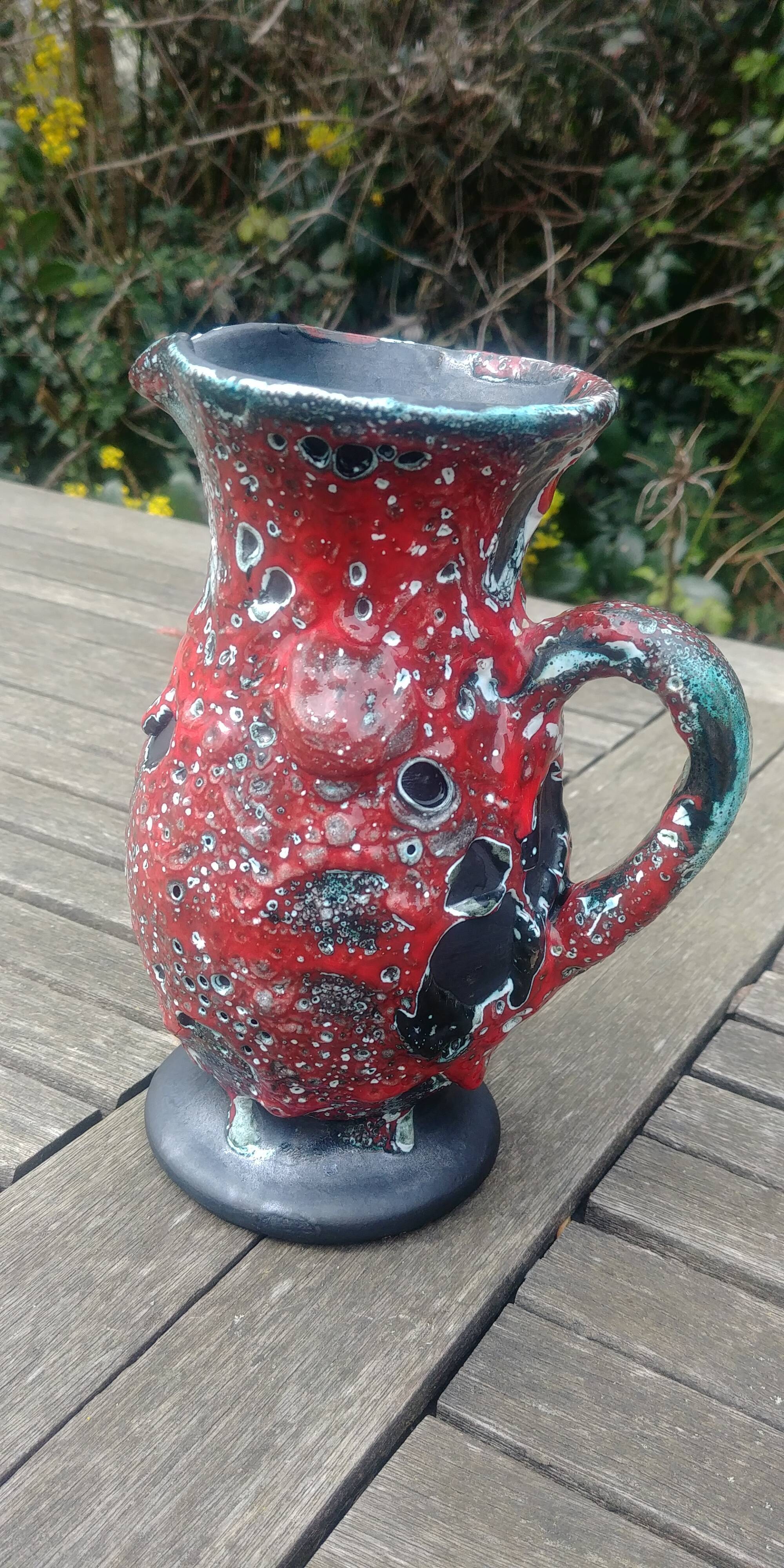 Glazed ceramic pitcher in Fat Lava style
