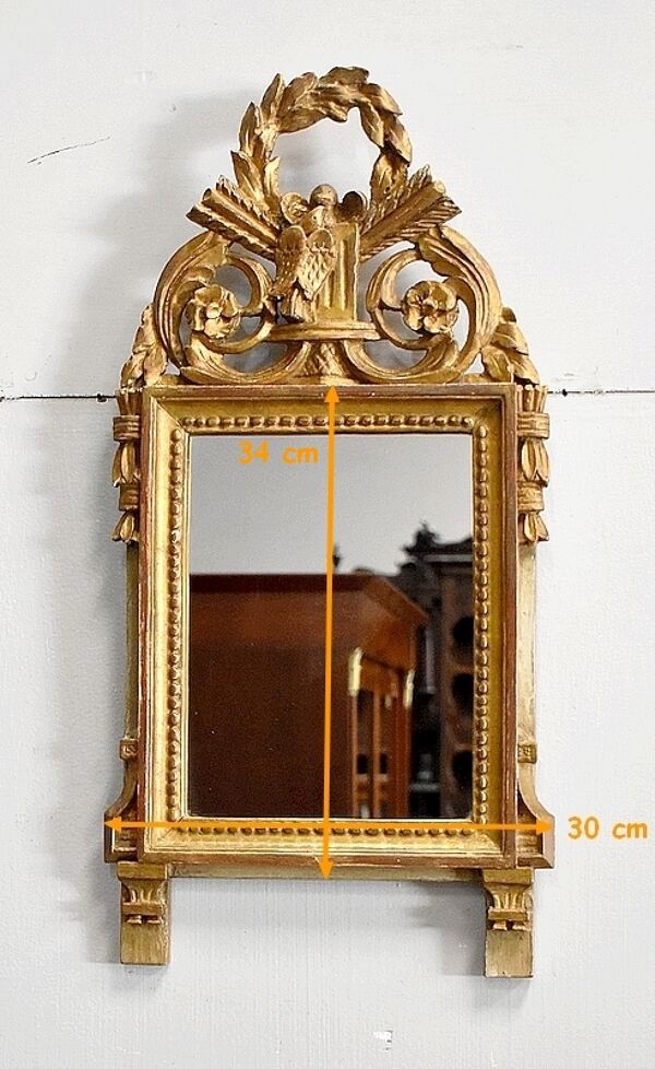 Miroir en bois doré, style Louis XVI – 1ère partie XXe - 60x30cm