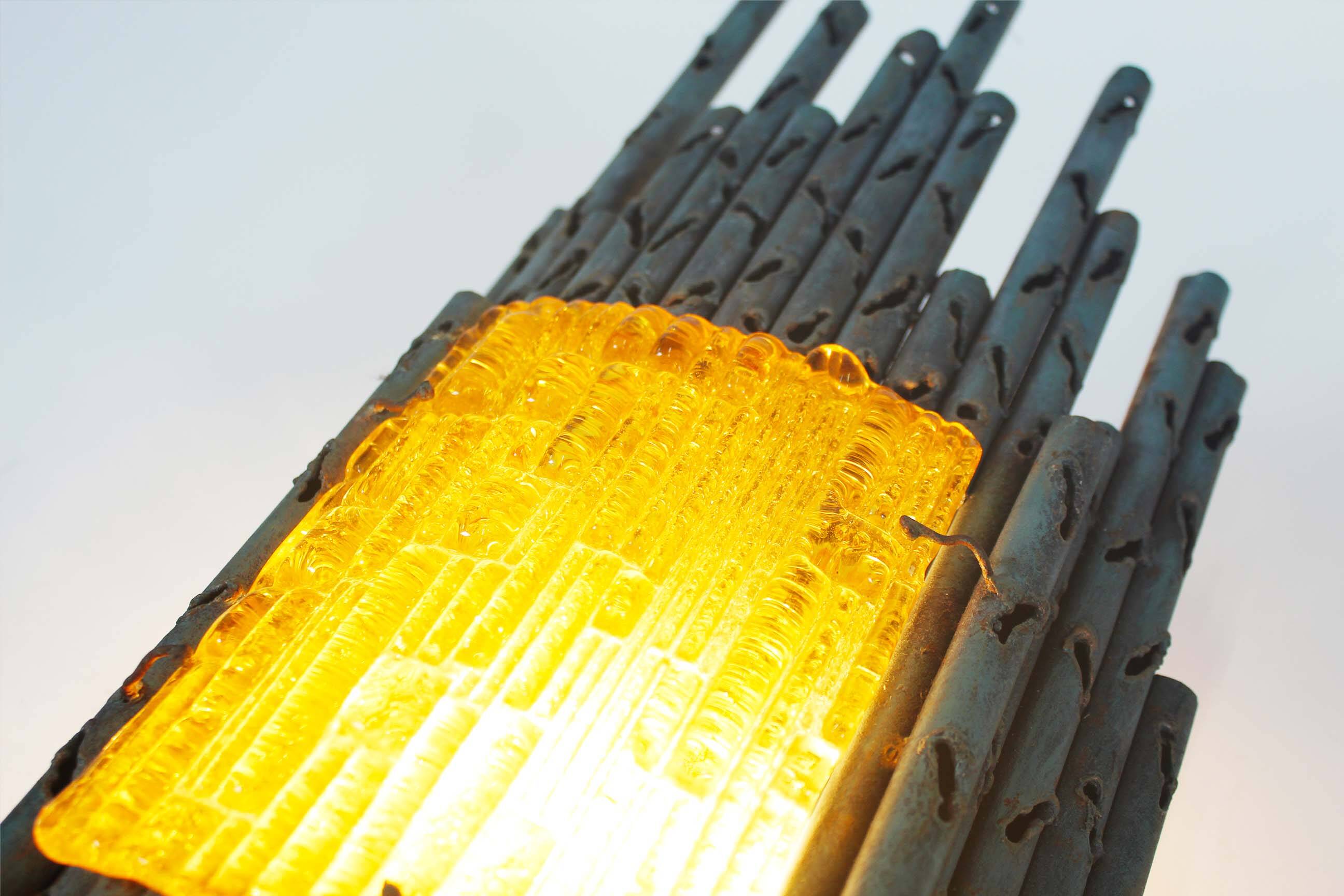 brutalist rough iron and glass wall sconce by Marcello Fantoni