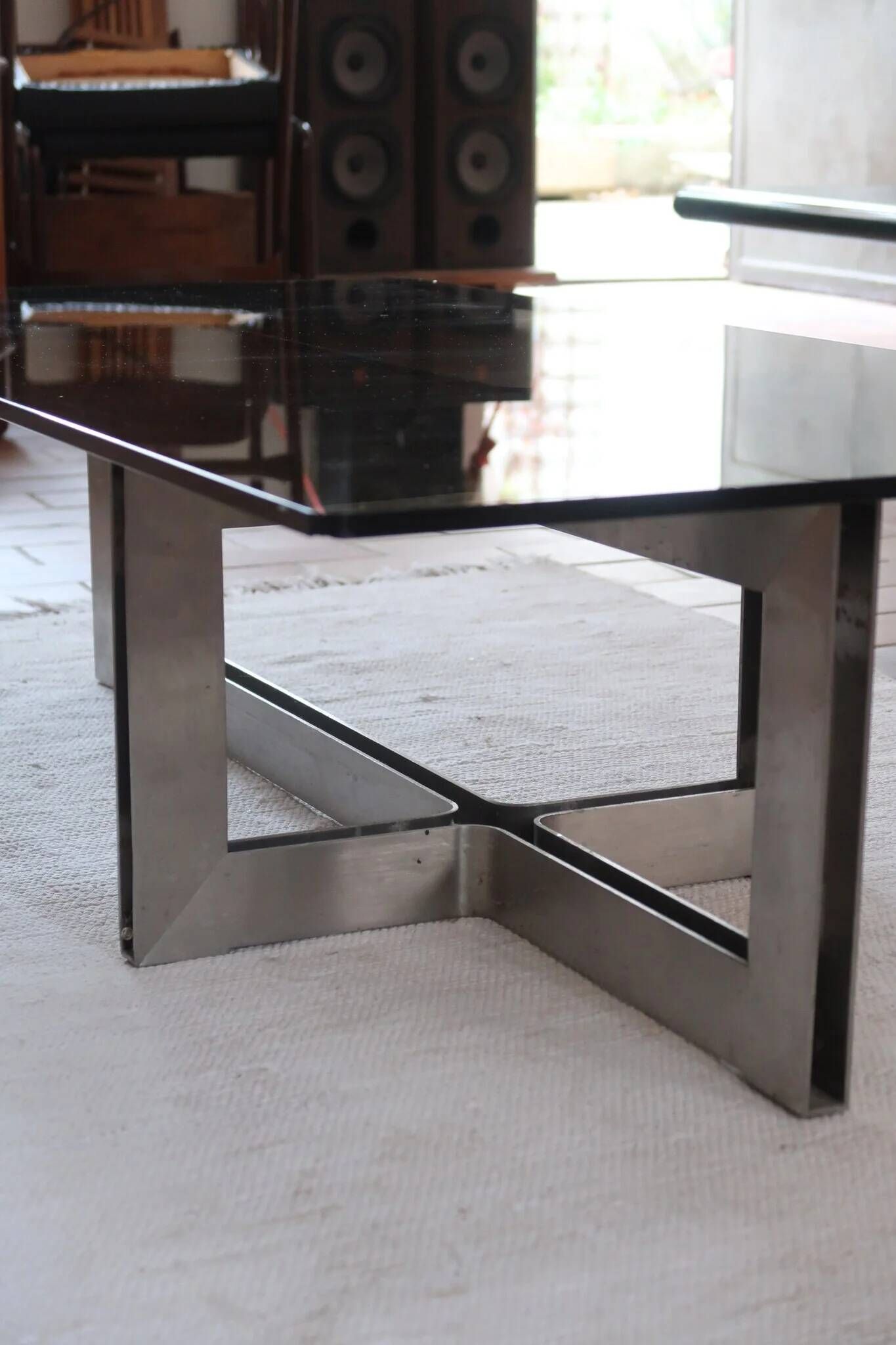 Smoked glass coffee table, brushed stainless steel base, 1970s.