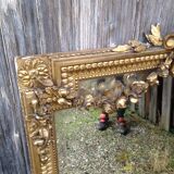 Wooden fireplace mirror and Gilded Louis XVI-style plaster with leaf