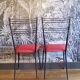 Pair of red Colette Guéden chairs