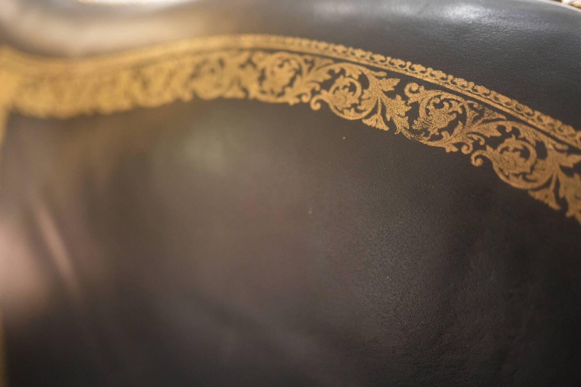 Lacquered and carved moulded wooden armchair