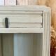 White patinated bedside table with a marble top