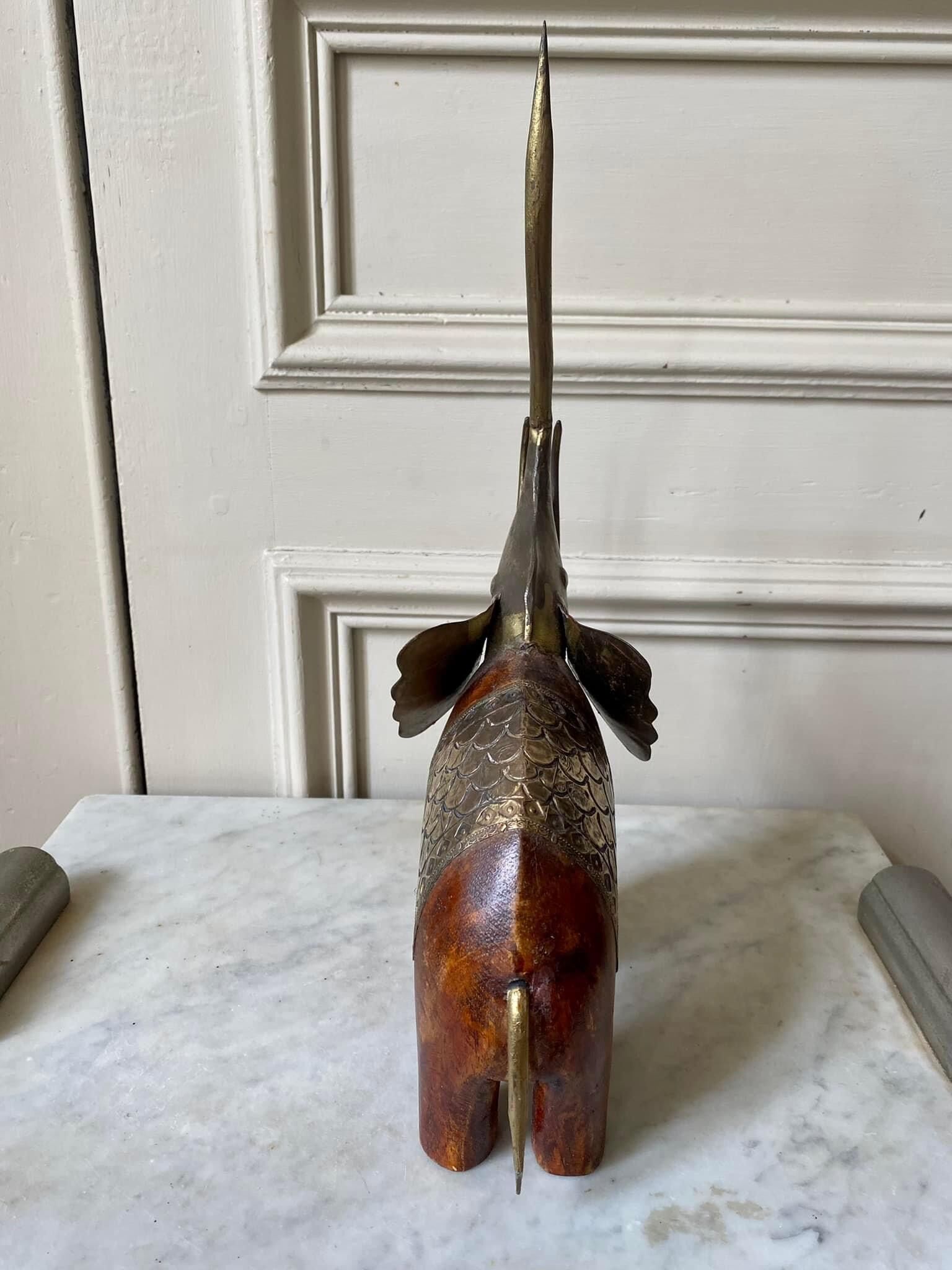 Wooden elephant and brass