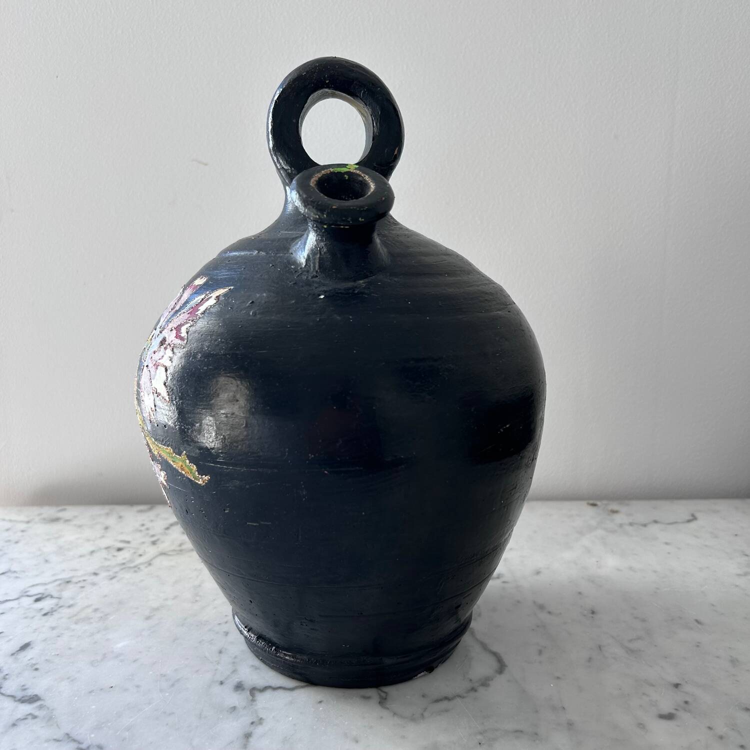 Black water jug with floral decoration