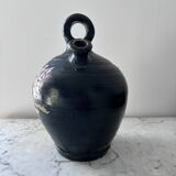 Black water jug with floral decoration