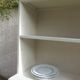 Vintage library enhanced in beige, wooden top.
