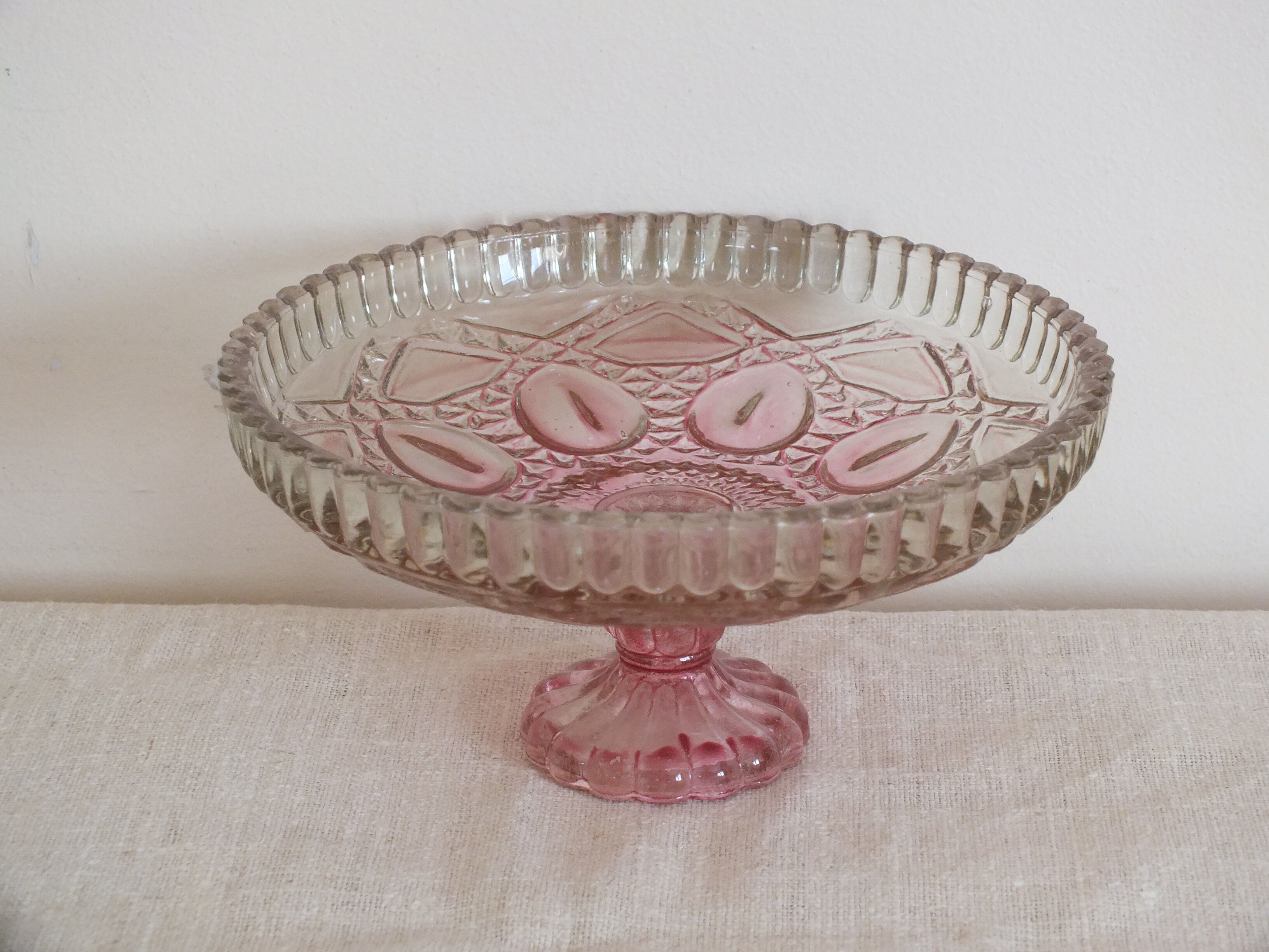 Small pink tinted molded crystal display cup