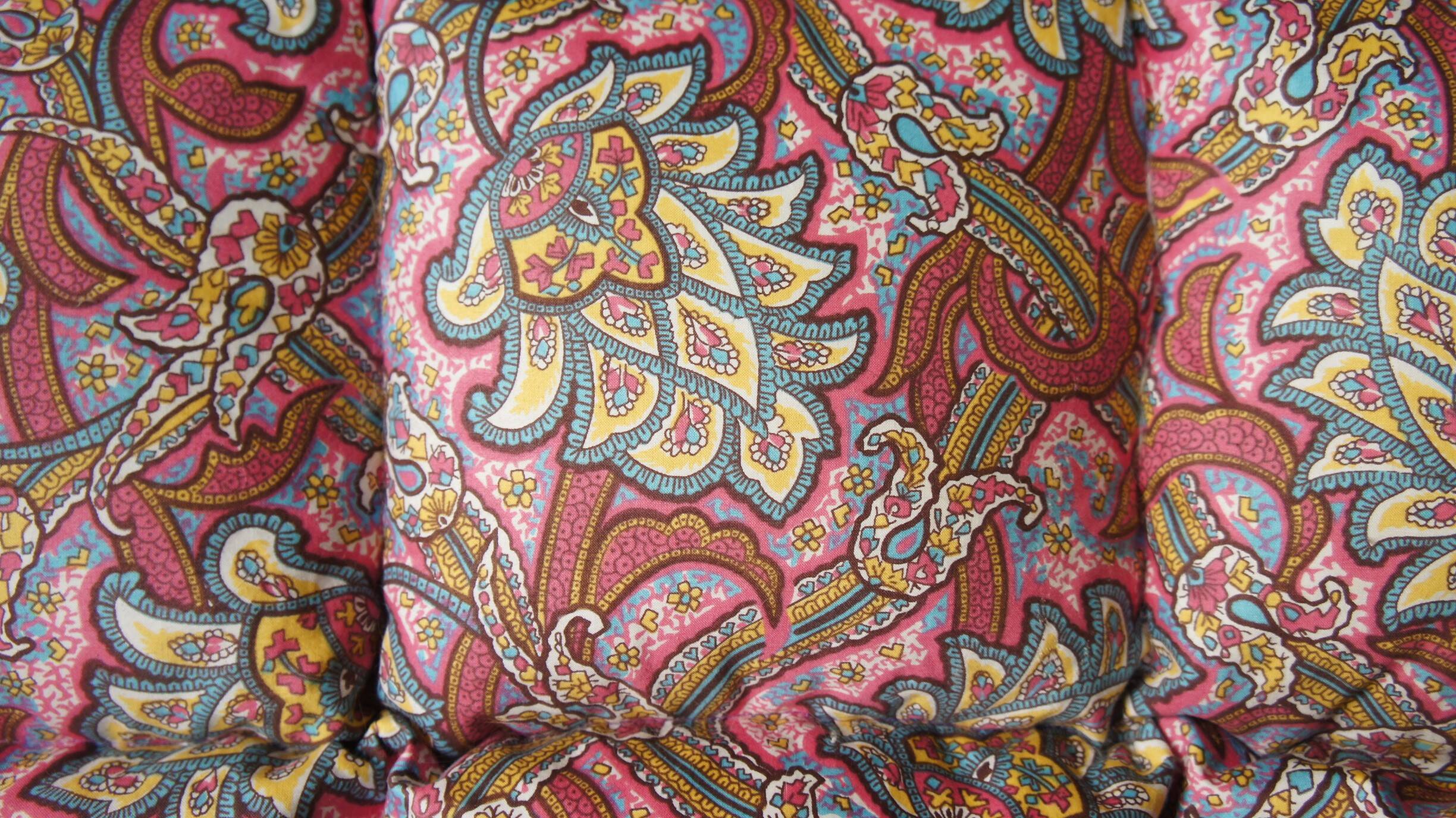 Small quilt filled with paisley pattern feathers
