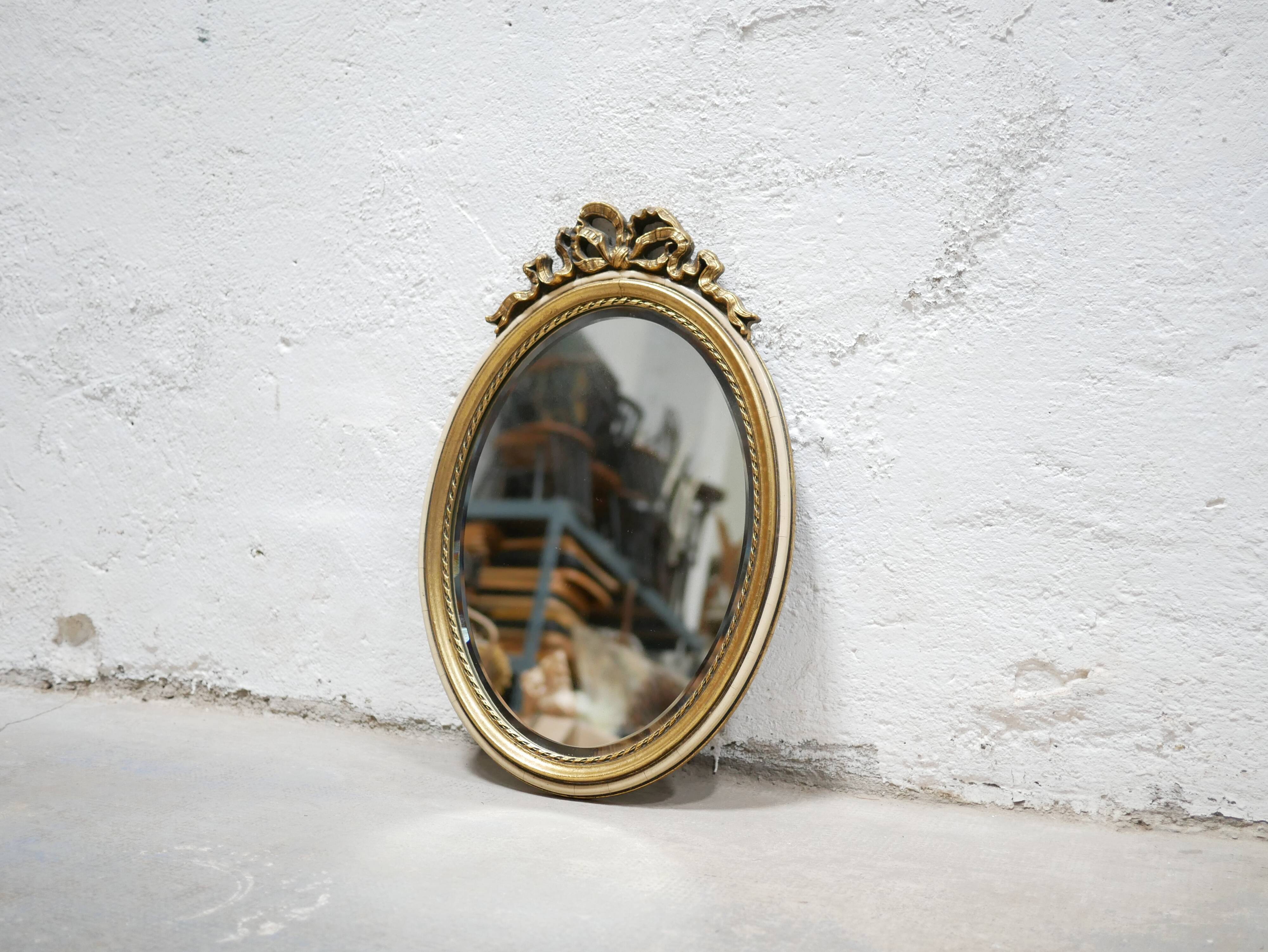 Old oval mirror Louis XVI style in gilded wood 50cm x 34cm