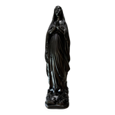 Tilted religious statue of Saint Mary