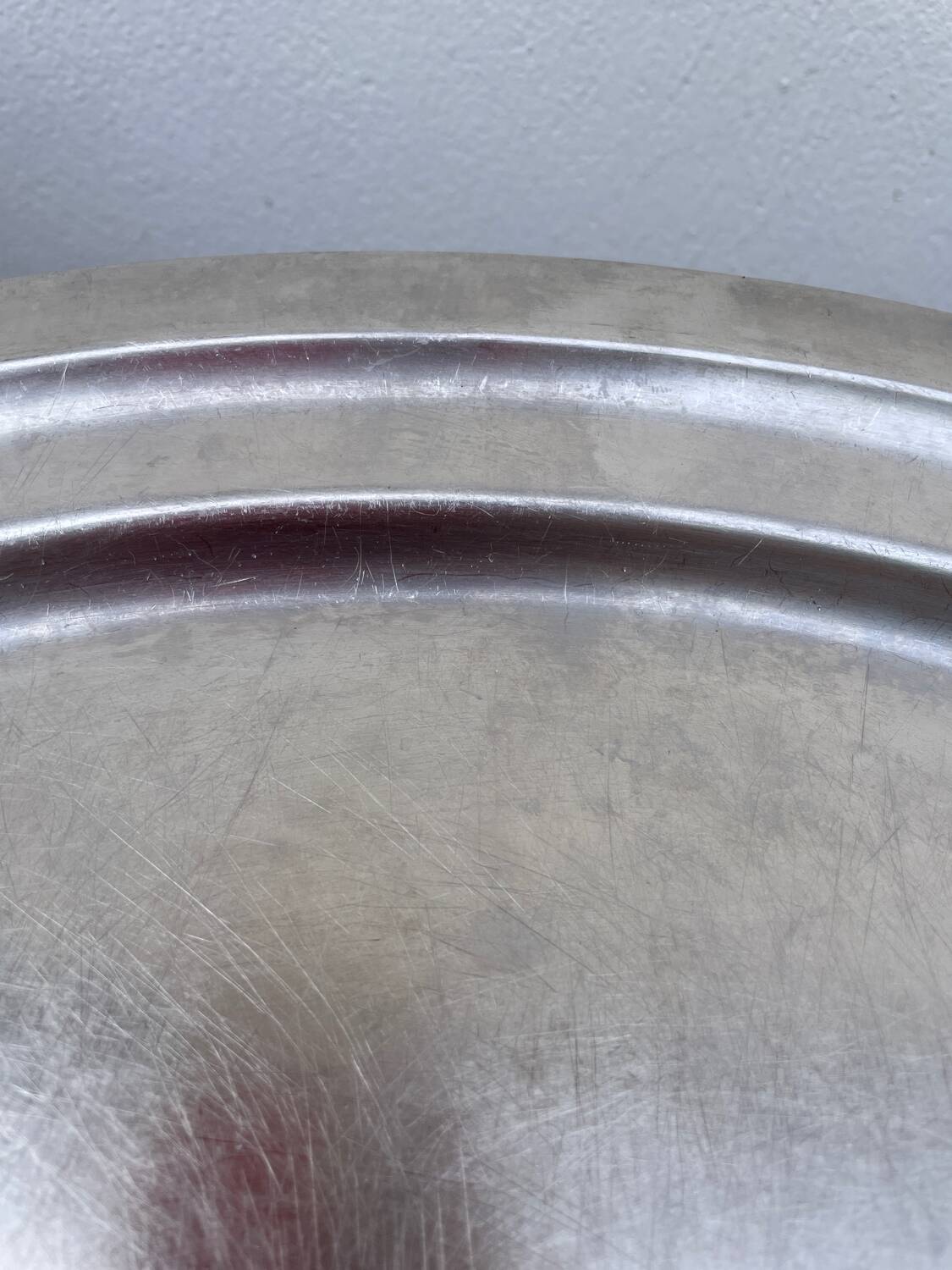 Oval stainless steel dish, signed Rémi Letang