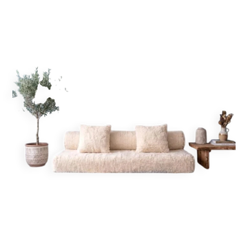 White Moroccan Arabic sofa with a rounded backrest.