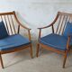 Pair of cozy teak armchairs with cushions